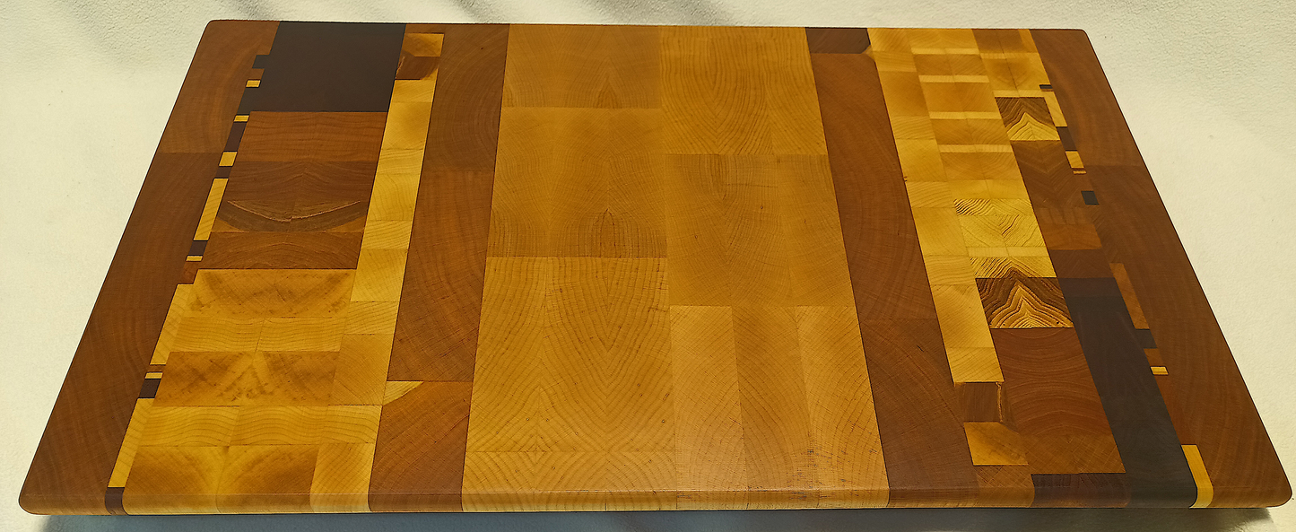 vtw versatile trees woodwork main view of a thin, large size end grain cutting board made with walnut, hickory, maple, mahogany, and cherry. Perfect for a home or professional chef, this board provides a usable work area without raising the work surface very far above the counter top