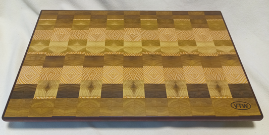 vtw versatile trees woodwork main view of a thin, large size end grain cutting board made with purple heart walnut, Hemlock, and Poplar. Perfect for a home or professional chef, this board provides a usable work area without raising the work surface very far above the counter top and softer woods are easier on expensive knives